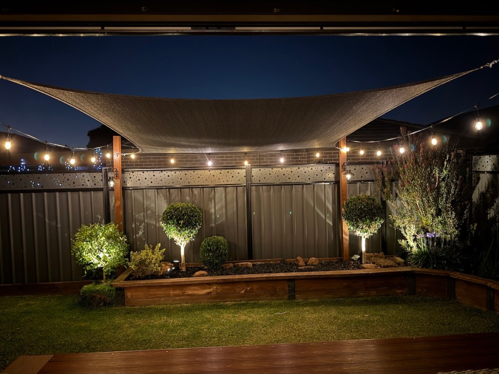 DIY Sail Shade with festoon lights.