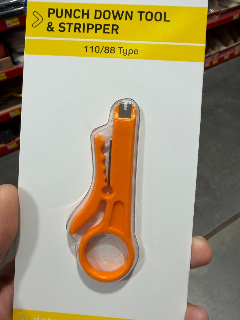 Basic Ethernet punch-down tool used to repair and re-terminate a network wall socket.